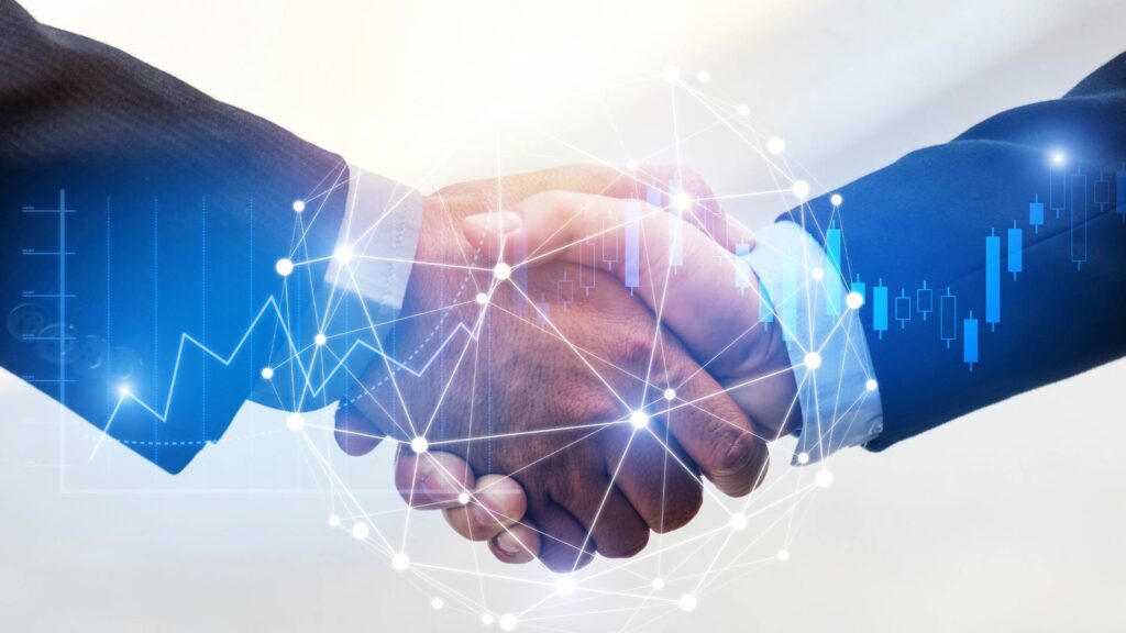 Aperto de mãos entre duas pessoas de terno, com gráficos digitais ao fundo, simbolizando parceria para empreender no mercado financeiro.